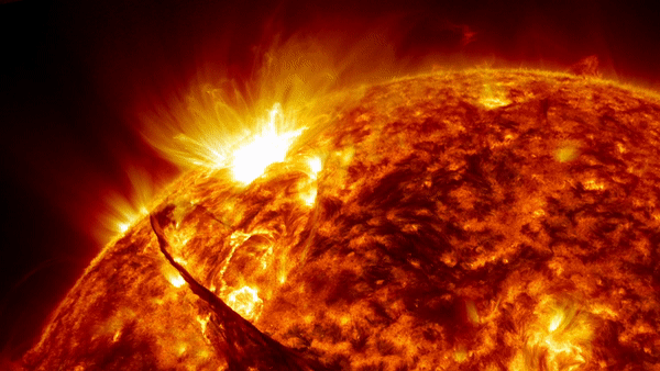 Solar flare erupting from the surface of the sun. This coronal mass ejection (CME) event occurred on 31st August 2012, and was recorded at wavelengths of 171 and 304 angstroms by NASA's Solar Dynamics Orbiter (SDO). The huge plume of solar material was thrown from the Sun at some 900 miles per second (1450 kilometres per second)