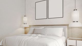 A bedroom with white walls and white décor