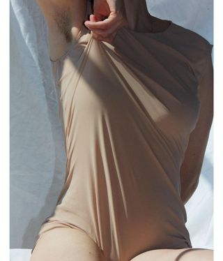 woman in bodysuit