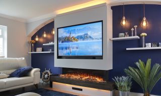 TV media wall showing a TV recessed into a wall with an electric fire below it