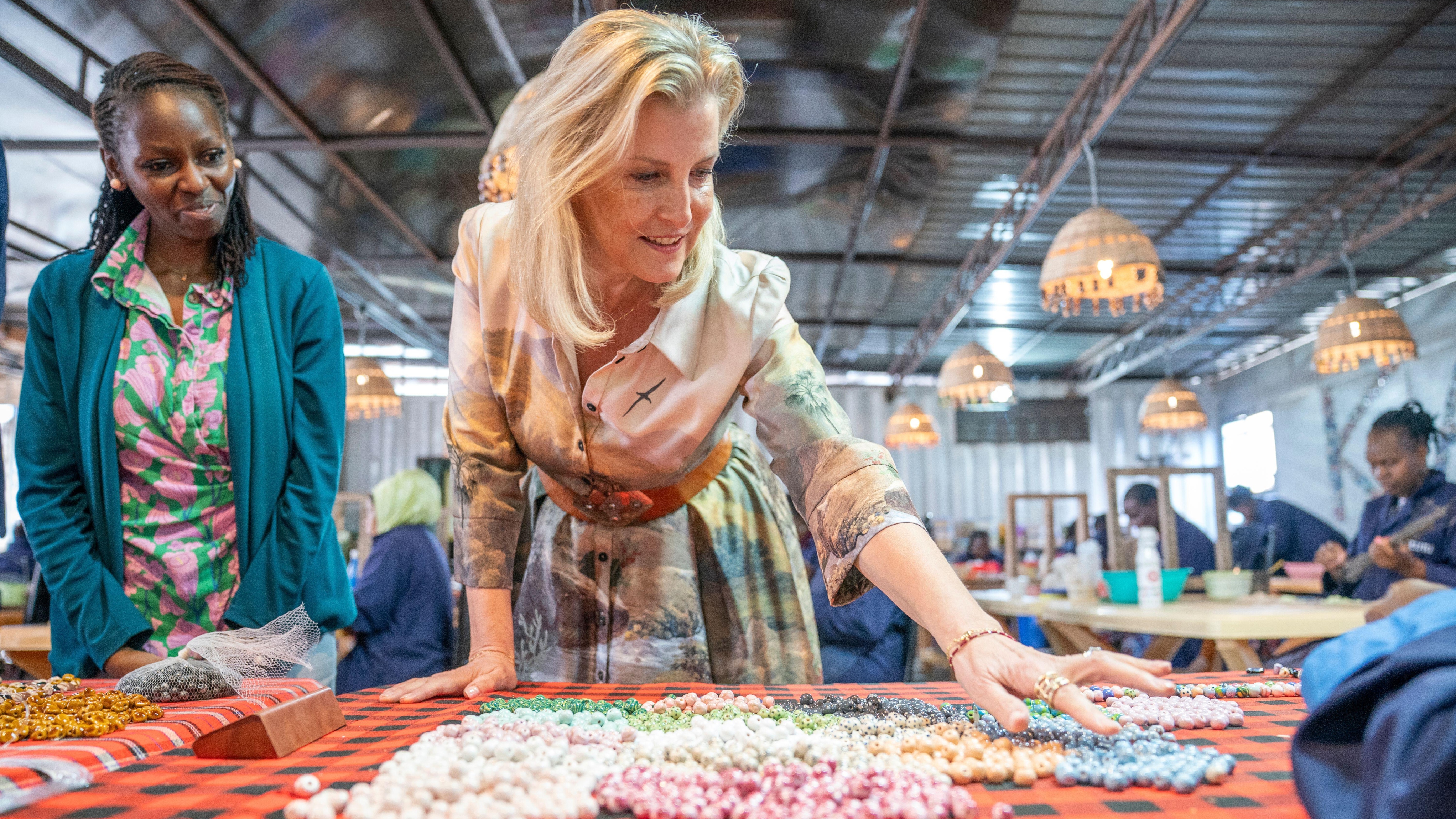 Duchess of Edinburgh looks on during a visit to Kazuri Beads in Kenya