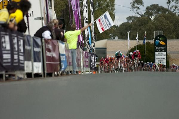 Riders charge towards an intermediate sprint point during stage nine in Euston.