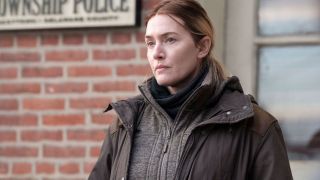 Kate Winslet's Mare stares into the distance in Mare of Easttown