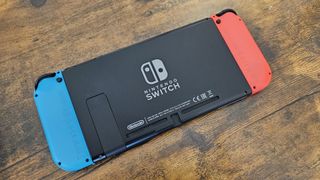 Back on the Nintendo Switch console on a wooden desk