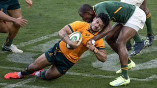 Hunter Paisami of the Wallabies is tackled by Makazole Mapimpi of the Springboks during The Rugby Championship