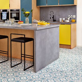yellow and blue kitchen with blue patterned floor