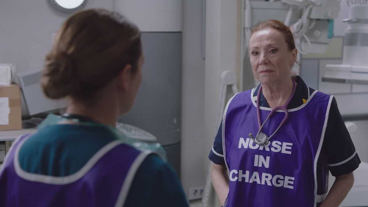 Embargoed 18/2/25 Siobhan in her uniform and purple &#039;NURSE IN CHARGE&#039; big looking grim and talking to Stevie. 