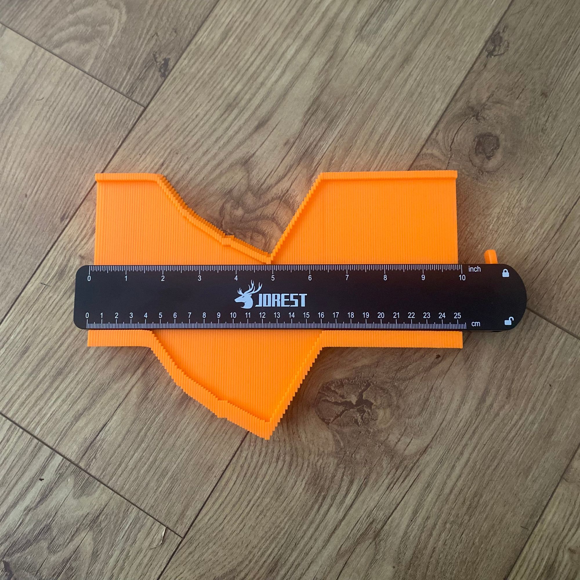 Contour gauge with profile locked in place ready to be traced