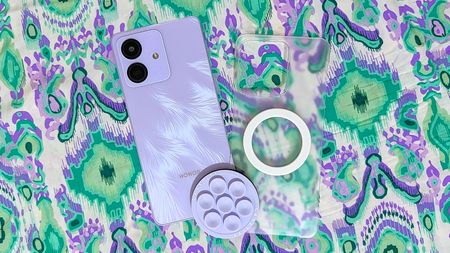 Honor Play 10 with a clear case, a magnetic ring sticker, and MagSafe accessories.