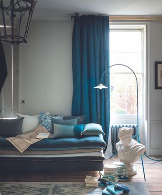 Living room with long blue curtains