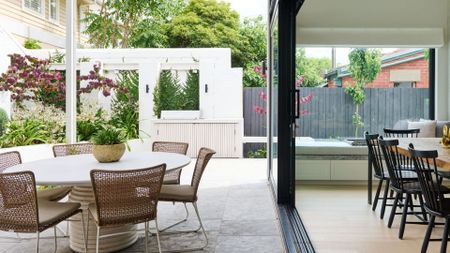 Monochrome exterior with bold black-framed arched windows