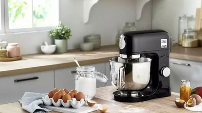 Black stand mixer on kitchen island