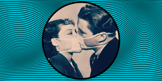 Black and white photo of a couple kissing wearing face masks.