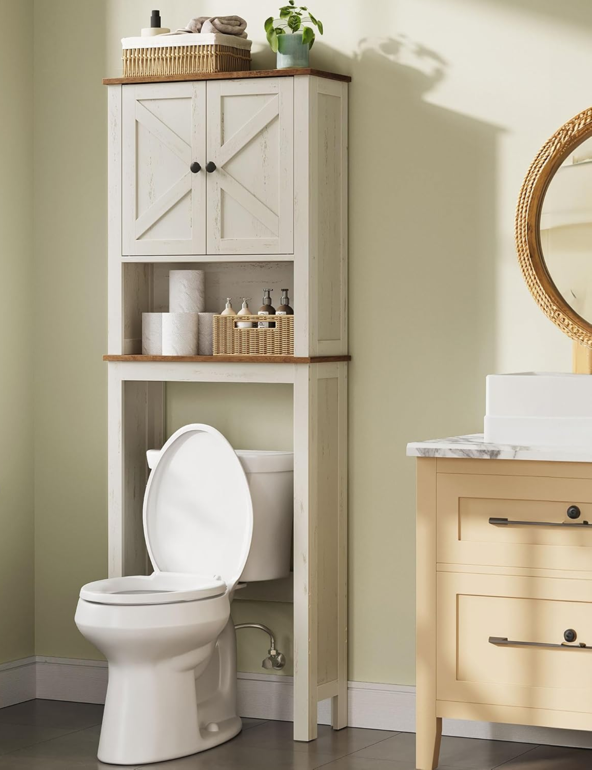 Farmhouse-style bathroom over-storage cabinet styled in a cheerful bathroom area alongside a butter yellow vanity area with a circular mirror