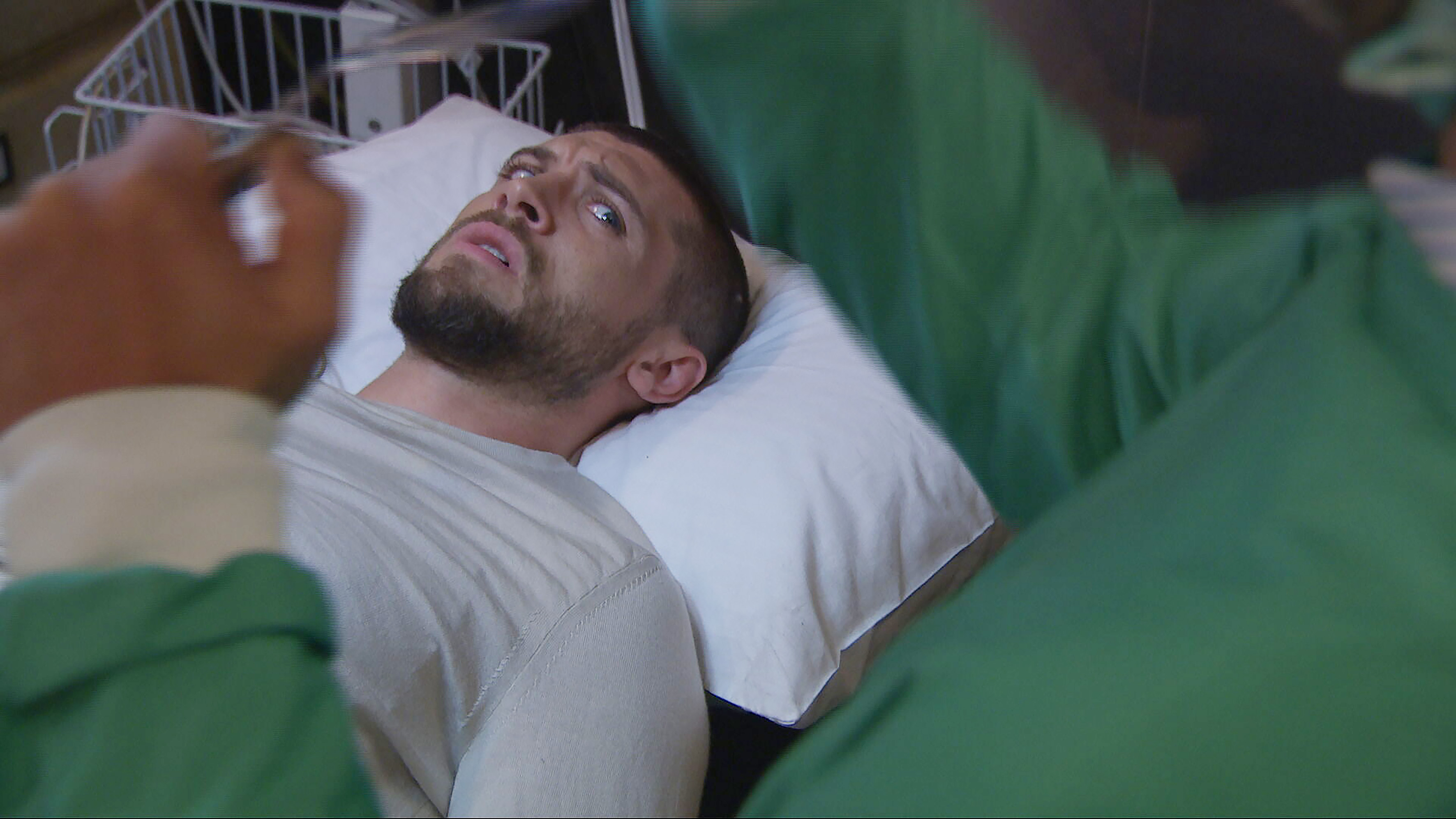 Joe Tate finds Dr Crowley looming over him holding a syringe!