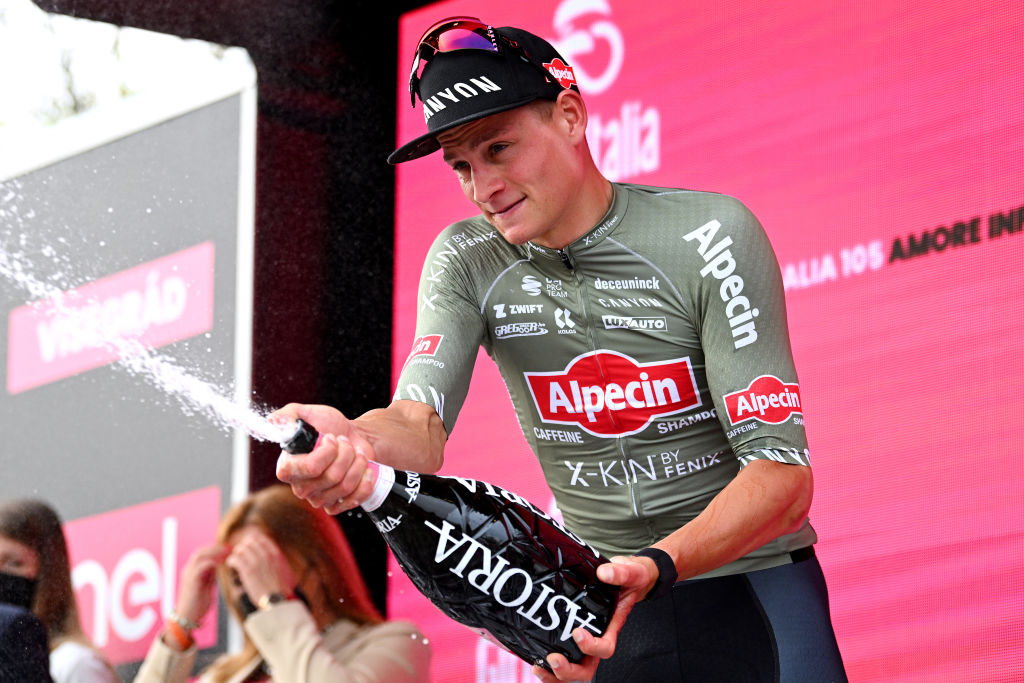 VISEGRAD HUNGARY MAY 06 Mathieu Van Der Poel of Netherlands and Team Alpecin Fenix celebrates at podium with champagne as stage winner during the 105th Giro dItalia 2022 Stage 1 a 195km stage from Budapest to Visegrd 337m Giro WorldTour on May 06 2022 in Visegrad Hungary Photo by Stuart FranklinGetty Images