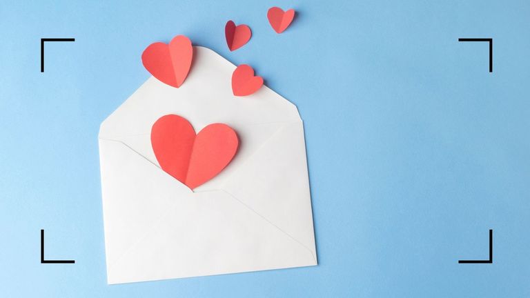 love hearts in an envelope representing a love horoscope 2022