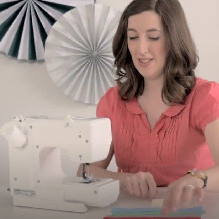 Women with white sewing machine