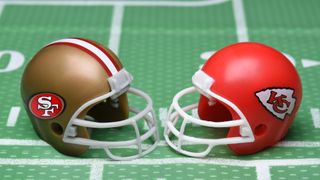 KC Chiefs and SF 49ers helmets on football field