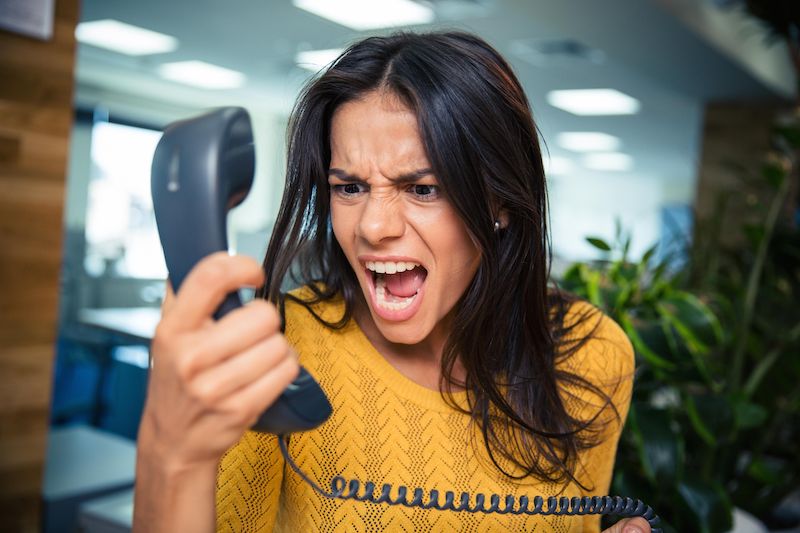 A woman screams in rage.