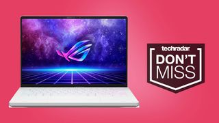 an opened white laptop with the asus logo against a pink background