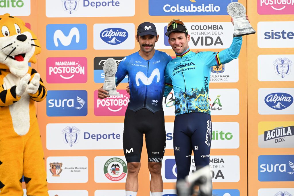 ZIPAQUIRA COLOMBIA FEBRUARY 09 LR Second place Fernando Gaviria of Colombia and Movistar Team and stage winner Mark Cavendish of The United Kingdom and Astana Qazaqstan Team celebrate at podium during the 4th Tour Colombia 2024 Stage 4 a 1818km stage from Paipa to Zipaquira on February 09 2024 in Zipaquira Colombia Photo by Maximiliano BlancoGetty Images