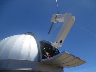 The mount for the Haleakala observatory is lifted into the dome.
