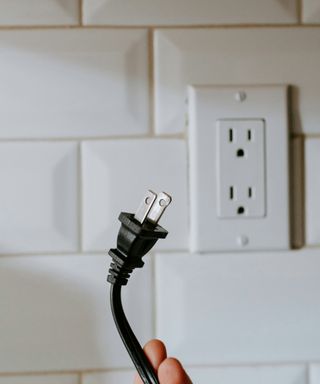 a plug and socket on a wall