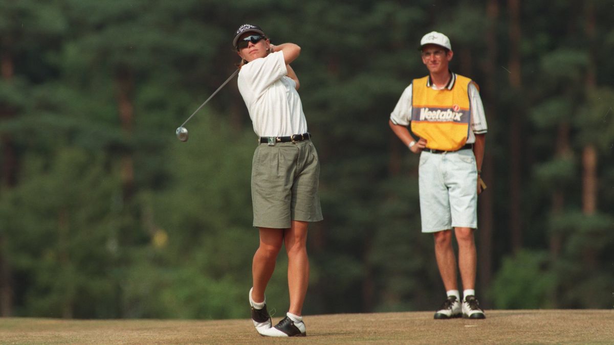 Golfer preparing a shot on the course, highlighting alignment and precision.