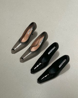 two pairs of gray and black peep-toe pumps from ACNE Studios' spring 2025 collection