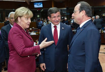 German Chancellor Angela Merkel and French President Francois Hollande meet with Turkish Prime Minister Ahmet Davutoglu in Brussels