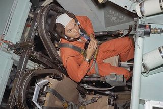 Michael Collins sitting in the three-seat gondola on the centrifuge at the Manned Spacecraft Center on April 14, 1969.
