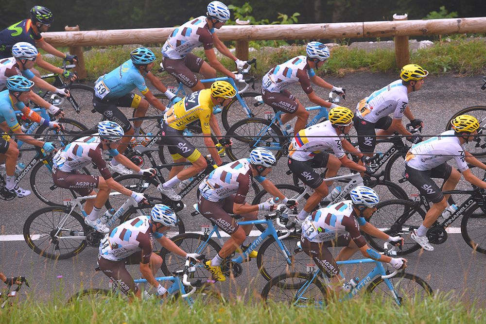 Chris Froome and the peloton climb in the fog during stage 12 at the Tour de France