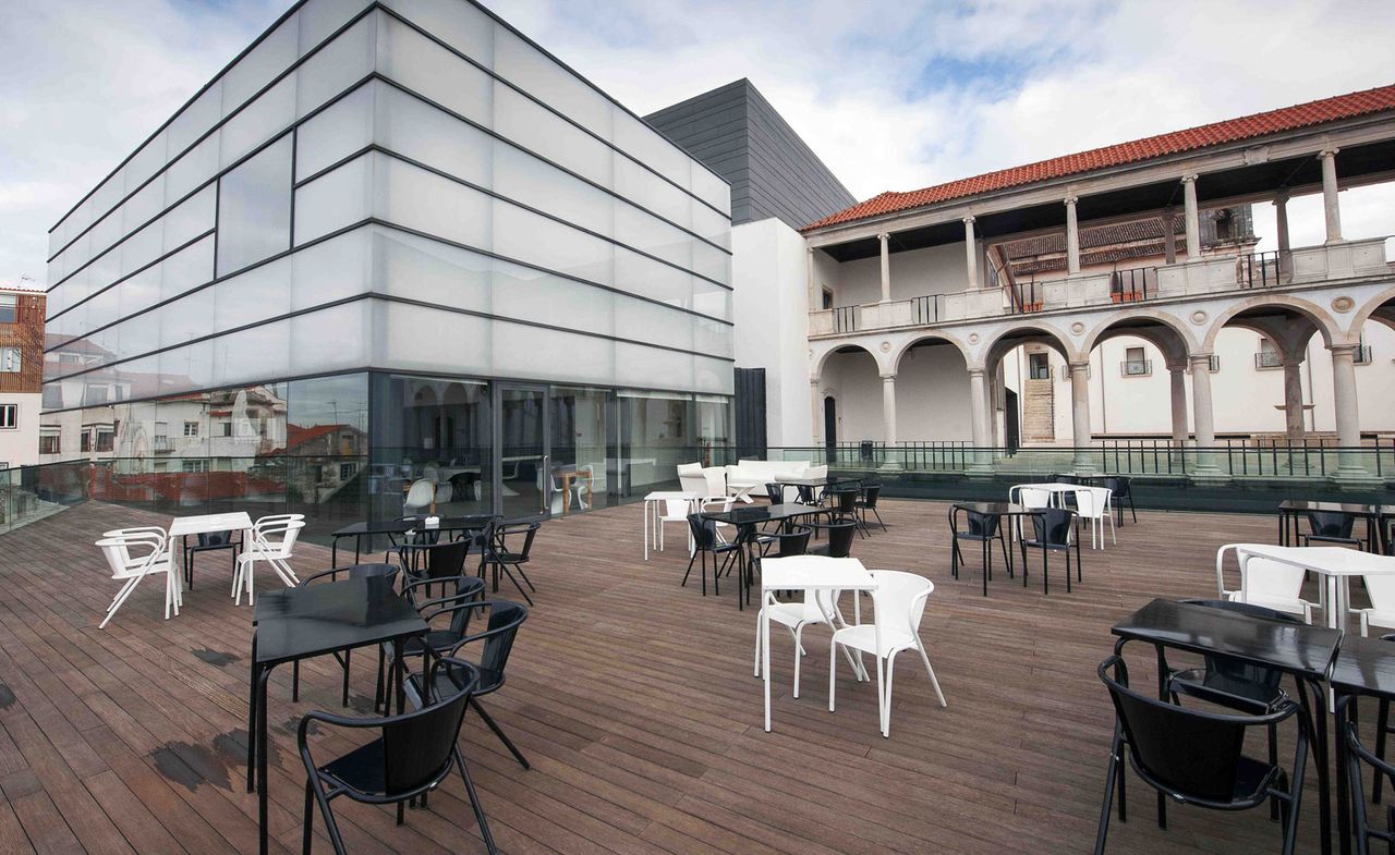 Loggia Restaurant outside area with square black and white tables with matching chairs