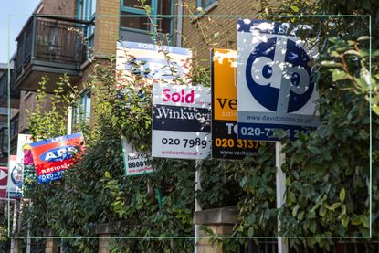 multiple for sale and sold signs from estate agents outside apartments
