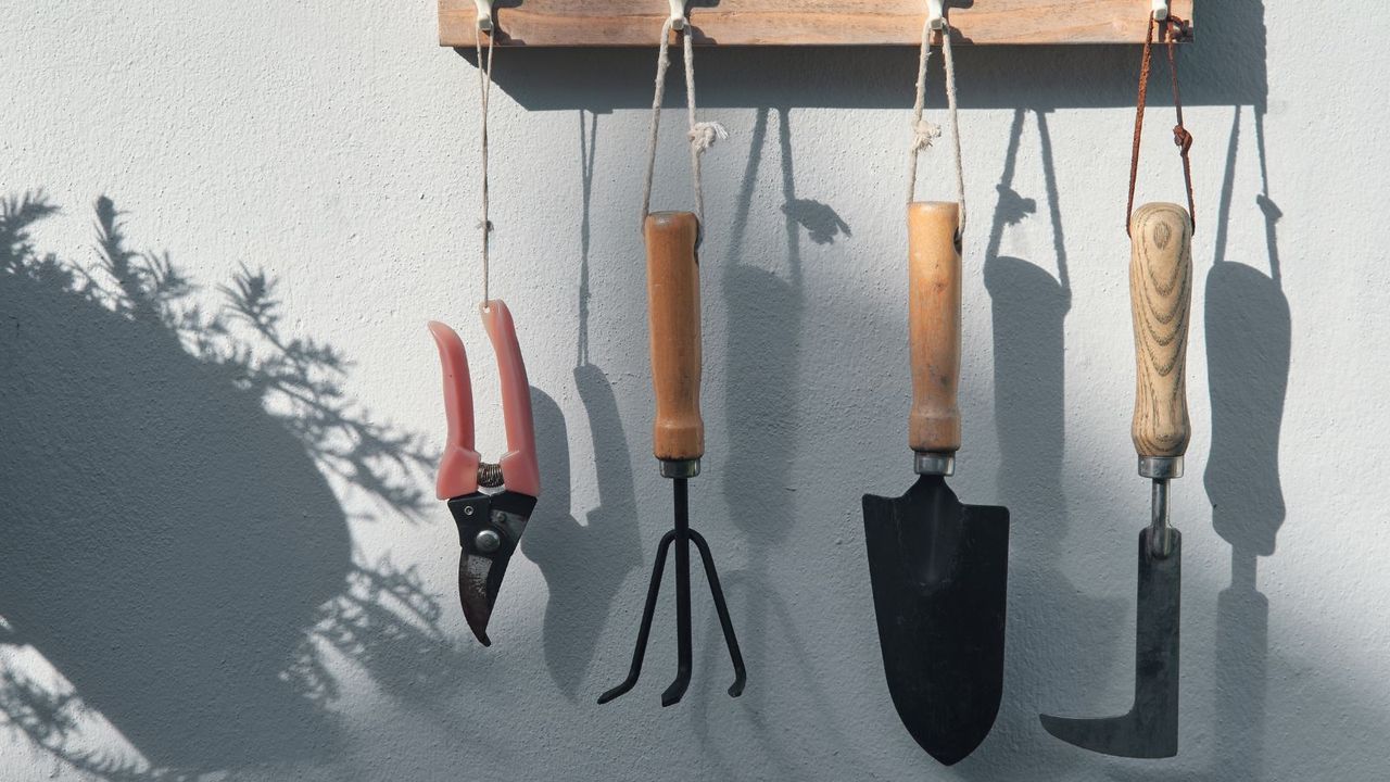 Garden tools hanging on a wall 