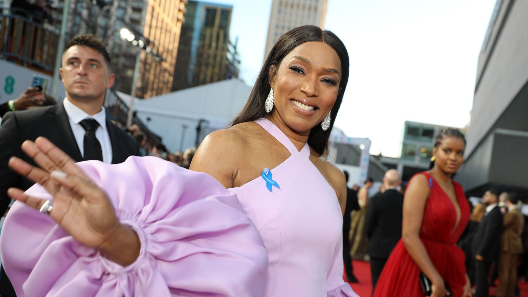 Why Celebrities Are Wearing Blue Ribbons at the 2023 Oscars