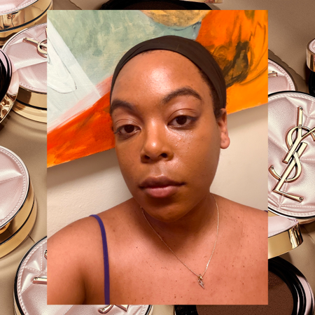 A woman with glowing skin. Behind her is various YSL compact foundations.