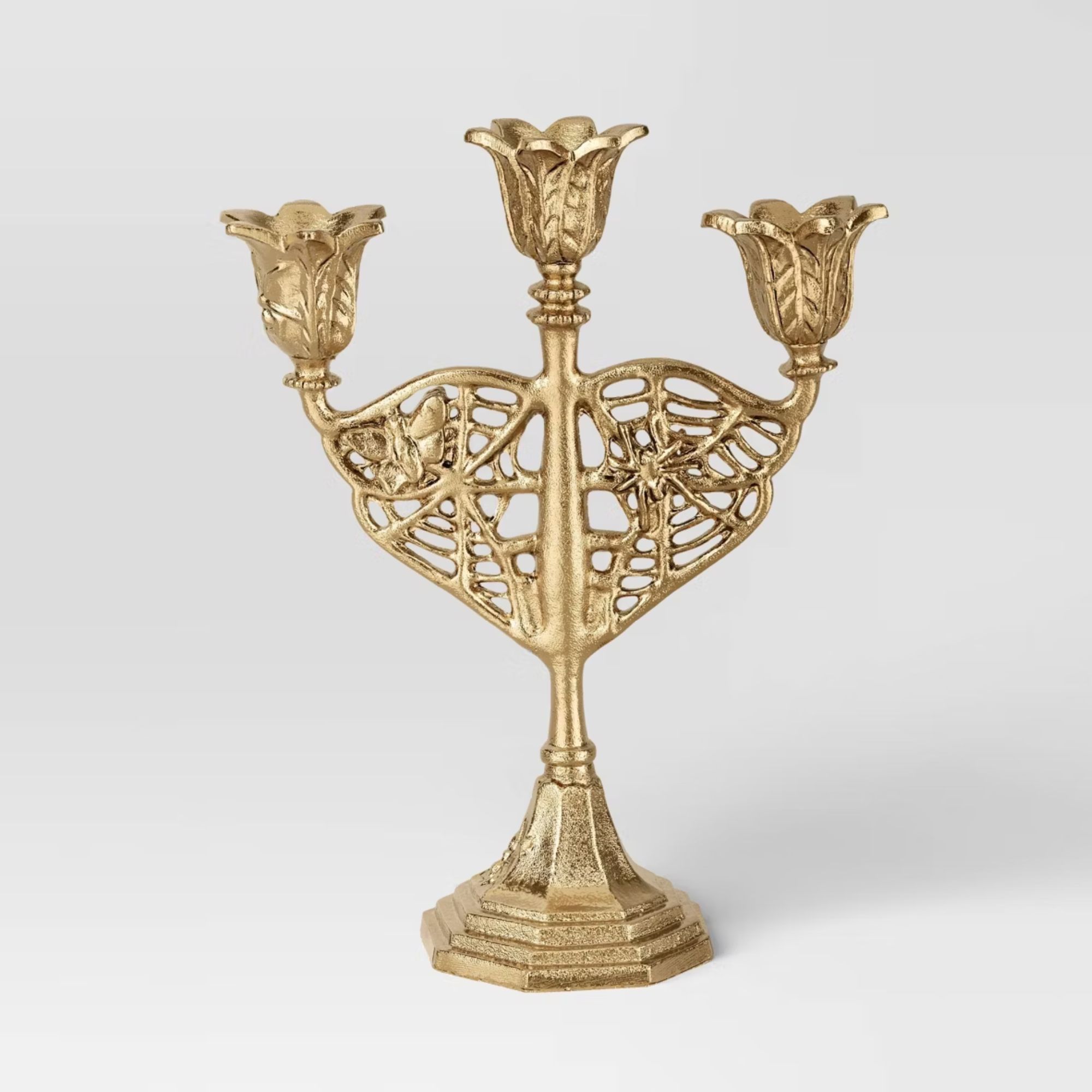 Gold candelabra with floral detailing