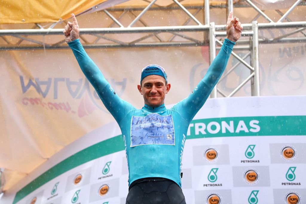 KUALA LUMPUR MALAYSIA OCTOBER 11 Gleb Syritsa of Russia and Astana Qazaqstan Team celebrates at podium as Blue sprint jersey winner after the 26th Le Tour de Langkawi 2022 Stage 1 a 1573km stage from Kuala Pilah to Kuala Lumpur PETRONASLTdL2020 on October 11 2022 in Kuala Lumpur Malaysia Photo by Tim de WaeleGetty Images