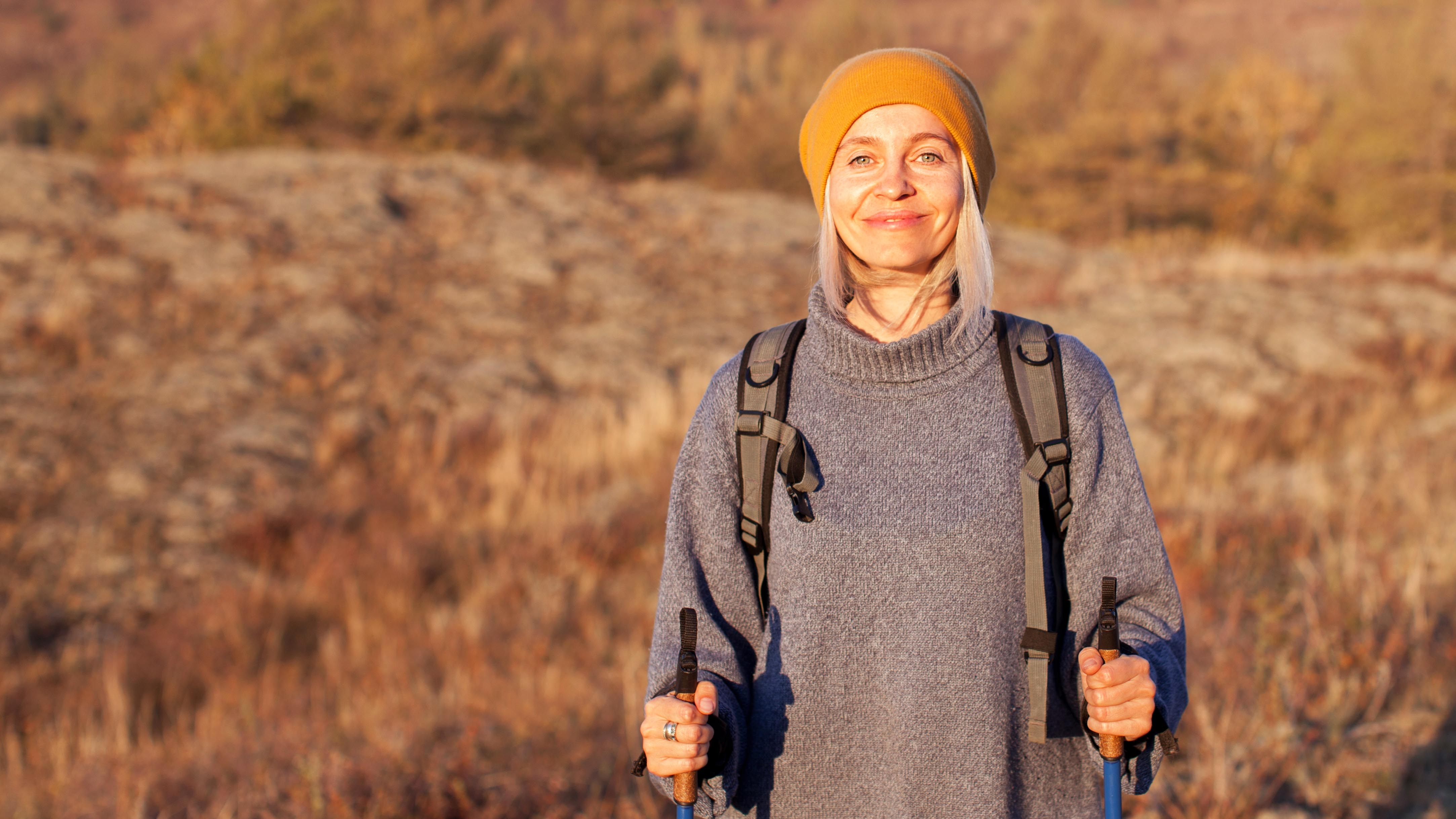 a middle aged woman doing a walking workout