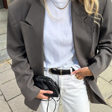 woman wearing grey blazer, white t-shire, black belt, and white jeans fall 2025