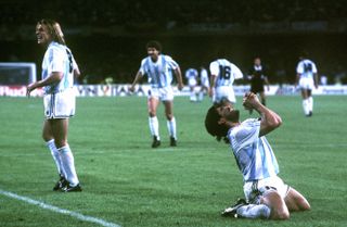 Diego Maradona celebrates after scoring for Argentina against Italy at the 1990 World Cup.