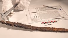 A scientist measures the "Excalibur" sword