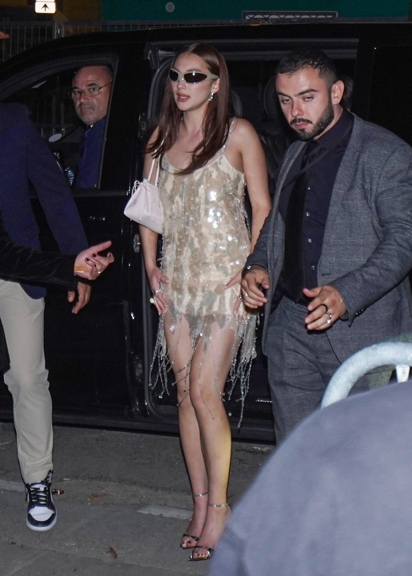 Lola Tung wearing a sequined minidress.