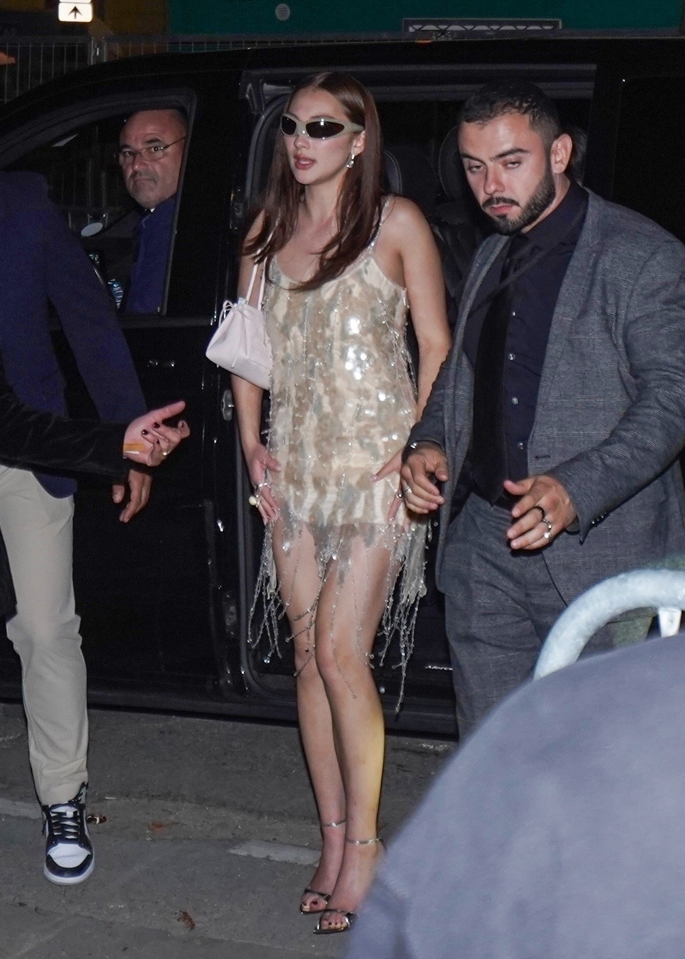 Lola Tung wearing a sequined minidress.
