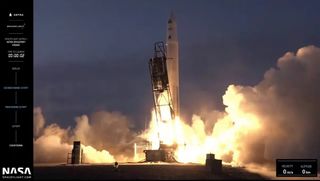 a white rocket launches into a darkening sky