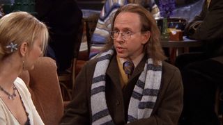 Bob Balaban guest stars as Phoebe's dad, wearing a coat and scarf, in Friends