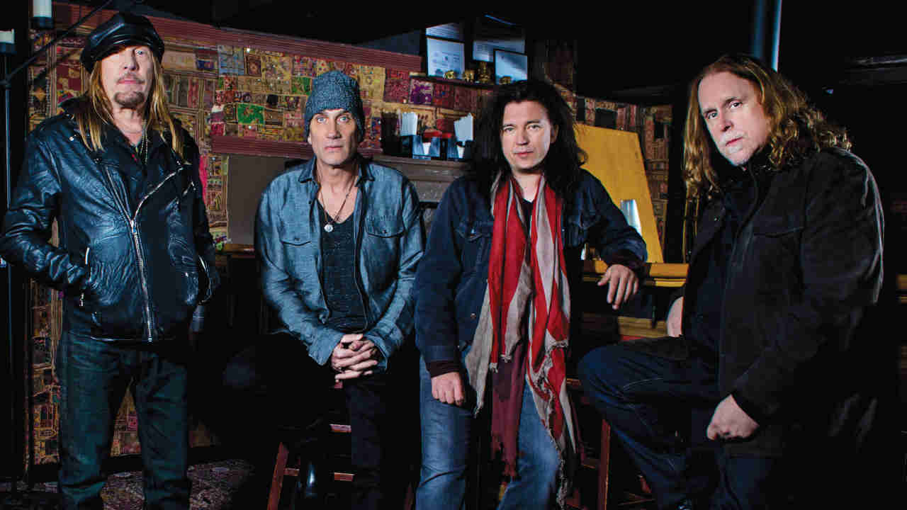 Gov’t Mule posing for a photograph in a bar in 2015