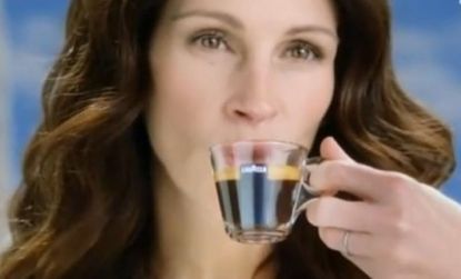 Julia Roberts stands, sips and smiles but never utters a word in this Italian coffee commercial. 